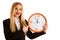 Beautiful business woman holds a clock as a sign for time manage