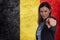 Beautiful businesswoman pointing her finger at you Belgian flag