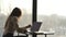 Beautiful businesswoman working at laptop in office