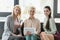 beautiful businesswomen sitting on sofa in office