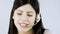 Beautiful call center girl talking on the phone with headset
