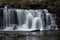 Beautiful calm landscape image of Scaleber Force waterfall in Yorkshire Dales in England during Winter morning