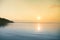 A beautiful, calm morning landscape of lake and mountains in the distance. Colorful summer scenery with mountain lake in dawn.