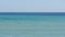 Beautiful calm three-colored sea with different shades of turquoise blue and dark green