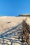 Beautiful calm view of nordic sand dunes and protective fences at Curonian spit, Nida, Klaipeda, Lithuania. Buried wood