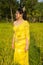 Beautiful Cambodian Asian Bride in Traditional Wedding Dress in a Rice Field