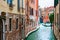 Beautiful canal with old medieval architecture in Venice, Italy