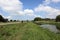 Beautiful canal with wildflowers in the English landscape in summertime