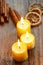 Beautiful candles and juicy oranges on jute table cloth