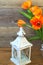 Beautiful candlestick lamp and yellow flowers tulips, fresh nature.