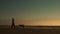 Beautiful Canon Beach. Man Walking On The Beach Dogs.