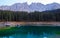 Beautiful Carezza Lake Lago di Carezza in background Latemar Mountains in Dolomites