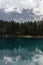 The beautiful Carezza lake with the Latemar mountain group in the background. Dolomites, Nova Levante, Bolzano, Italy.