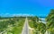 Beautiful Caribbean road with palm trees along the coast of Venezuela, aerial view.
