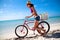 Beautiful caribbean woman with bicycle