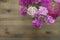 Beautiful carnation Pink fucsia Flowers on Wooden Surface with copy Space