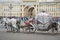 Beautiful carriage on Palace Square. People in carriage at Palace Square near Winter Palace of St. Petersburg. Summer 2016.