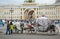 Beautiful carriage on Palace Square. People in carriage at Palace Square near Winter Palace of St. Petersburg. Summer 2016.