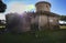 The beautiful castle of Julius II in Ostia Antica struck by the sun whose rays come out from walls