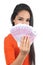 Beautiful casual muslim woman holding a lot of money