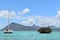 Beautiful catamaran in cristal waters, tourists enjoying a day at sea.