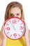 Beautiful caucasian casual woman holding red clock.