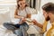 Beautiful caucasian couple sorting letters at home