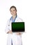 Beautiful Caucasian doctor or nurse holding a laptop compute
