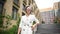 Beautiful caucasian elderly gray-haired woman in a white trouser business suit. Video 360 degrees.