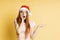 Beautiful caucasian female model wearing santa hat