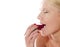 Beautiful caucasian lady tasting yummy strawberry