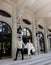 Beautiful caucasian newlywed couple with white dress walking