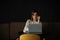 Beautiful caucasian woman concentrated while using laptop in a modern workspace. Cute young business woman speaking on the phone