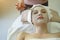 Beautiful caucasian woman having mask, lying on spa. Facial treatment in Spa salon