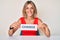 Beautiful caucasian woman holding change banner smiling with a happy and cool smile on face