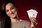 Beautiful caucasian woman with poker cards gambling in casino