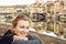 Beautiful caucasian woman posing in front of amazing bridge Ponte Vecchio, Florence, Italy