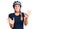 Beautiful caucasian woman wearing bike helmet afraid and terrified with fear expression stop gesture with hands, shouting in shock