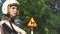 Beautiful caucasian woman wearing a helmet and sunglasses sitting on a bike.