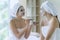 Beautiful caucasian women having mask together, friends have funny in spa. Facial treatment in Spa salon