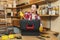 Beautiful caucasian young woman working in carpentry workshop at table place