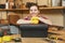 Beautiful caucasian young woman working in carpentry workshop at table place