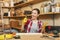 Beautiful caucasian young woman working in carpentry workshop at table place