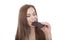 Beautiful caucasian ypung woman eating a chocolate bar.