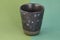 Beautiful ceramic Colourful Cup Mug. Glass model on stylish background