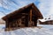 Beautiful chalet of wooden frame in the winter landscape.