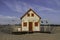 Beautiful characteristic wooden house along the beach side at Costa da Caparica in Lisbon, Portugal. Small village on the beach at