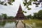 A beautiful chedi is located in the middle of the water at Huay Kaew Temple in Lop Buri Province