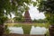 A beautiful chedi is located in the middle of the water at Huay Kaew Temple in Lop Buri Province