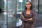 Beautiful cheerful african american executive business woman at the workspace office